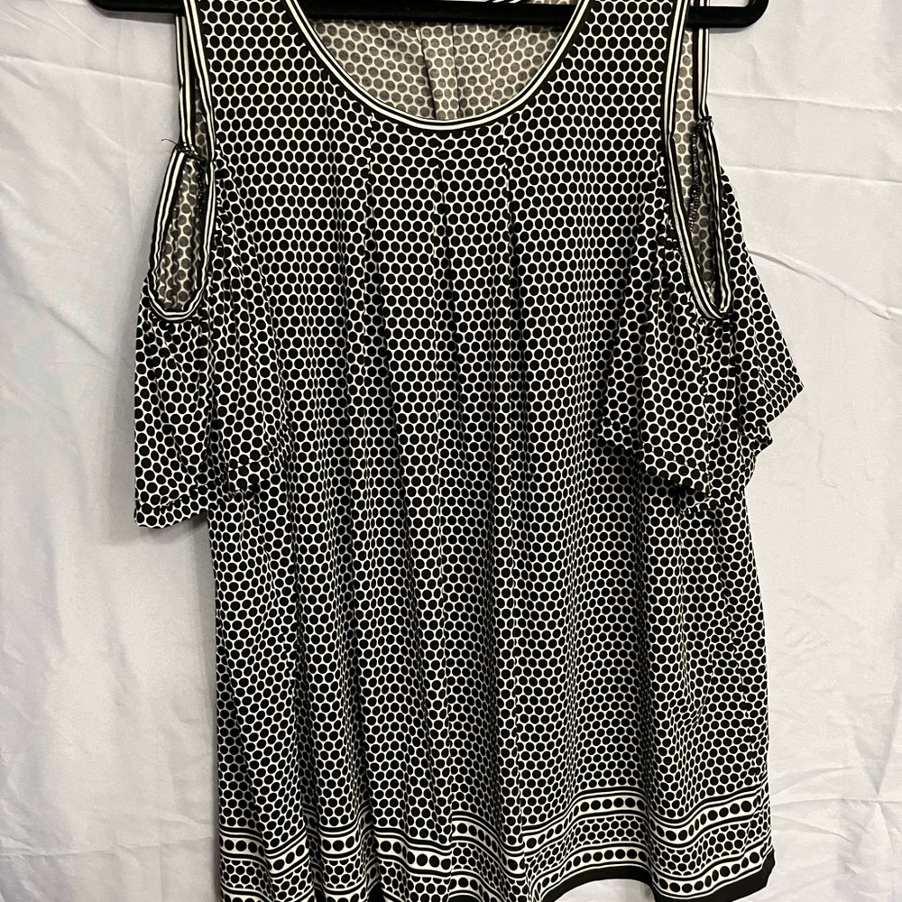 Black and White Polka Dot Women's Top with cold shoulder sleeve.